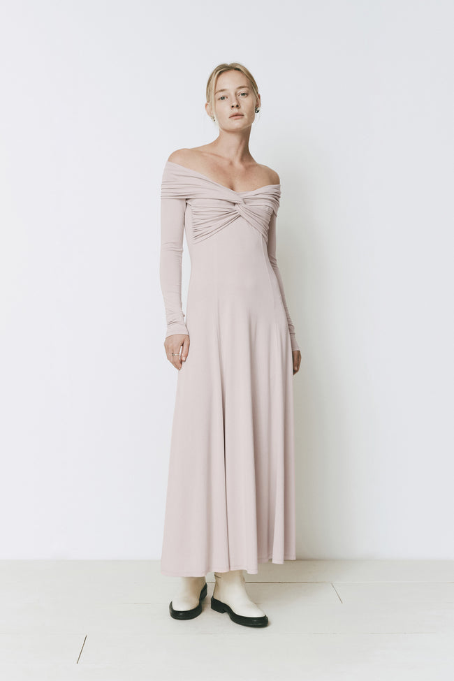 Ruesophie Giverny light pink off-shoulder maxi dress with twist-front bodice & long sleeves.