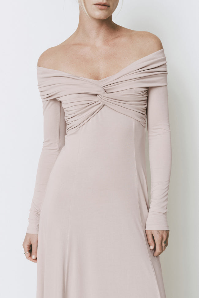 Ruesophie Giverny light pink off-shoulder maxi dress with elegant twist-front bodice and flowing long sleeves.