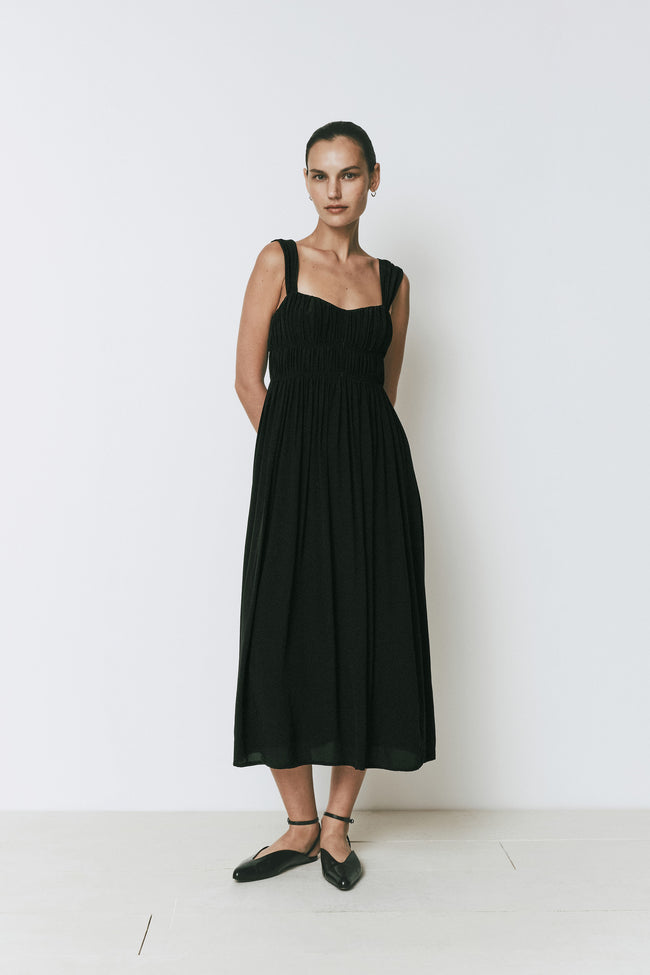 Black Coucou Dress. Midi A-line dress with sweetheart neckline and wide straps. Streetwear by Rue Sophie.