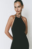 Black Opera Dress with halter neck, midi length, and open back. Featuring a model.
