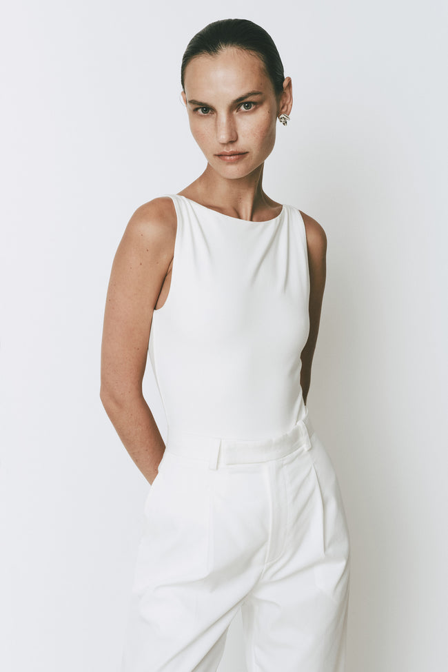 White Plage Bodysuit and matching trousers, sleek, minimalist design from Rue Sophie
