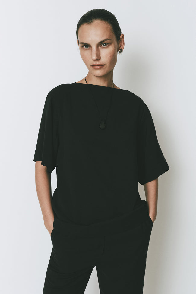Black Dusk Boatneck Top with quarter sleeves on a model
