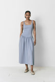 Sky blue midi dress with square neckline and drop waist. Perfect for summer occasions.