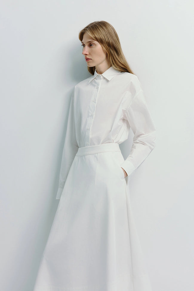 Woman in white Alda button-down shirt and skirt, 100% cotton