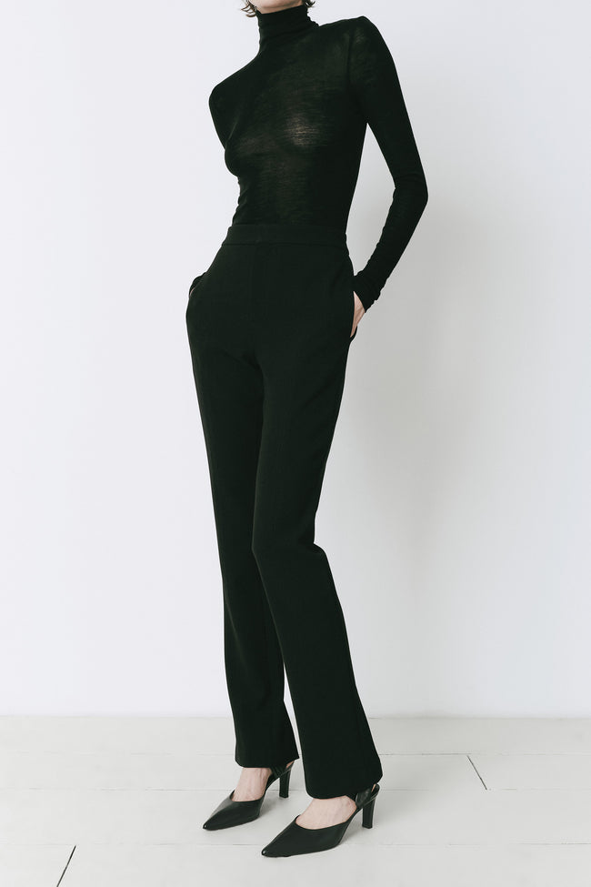 Baïa Slit Hem Pant styled with a black top, showcasing fit and fabric, polyester-rayon blend