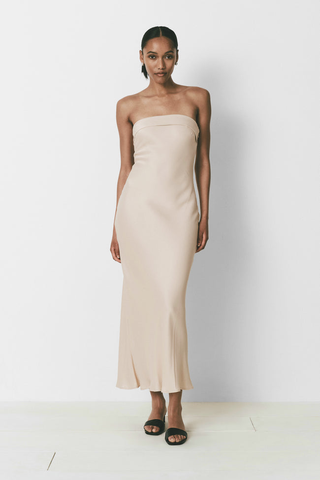 Strapless beige column dress for women, elegant and minimalist, perfect for special events.