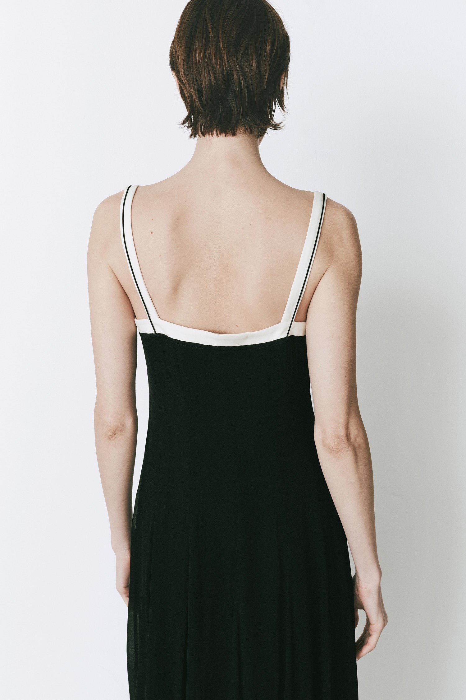 Ambroise Cami Dress black midi dress with white straps, back view, perfect for day to night events