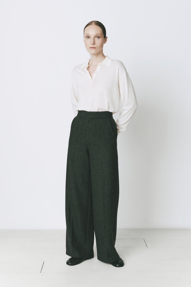 Concorde Herringbone Pant: Woman in dark green wool-blend, tailored wide-leg pants
