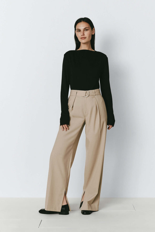 Eléonore Belted Pant in beige. Women's pleated front slit hem trousers.