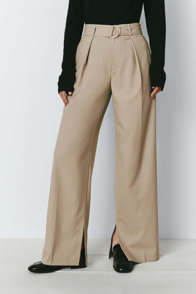 Beige Eléonore Belted Pant with pleats and slit hem, elegant and versatile.
