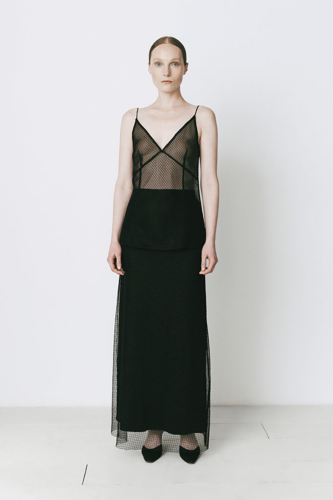 Black mesh maxi skirt and top outfit for fall/evening style. Featuring sheer detailing and tailored fit.