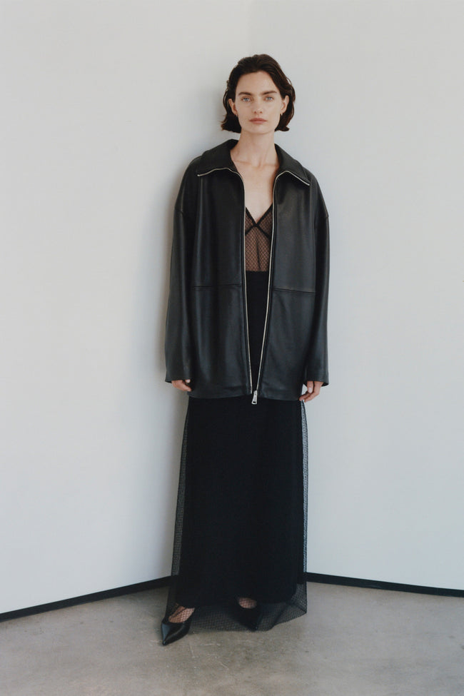 Black leather jacket, mesh skirt ensemble