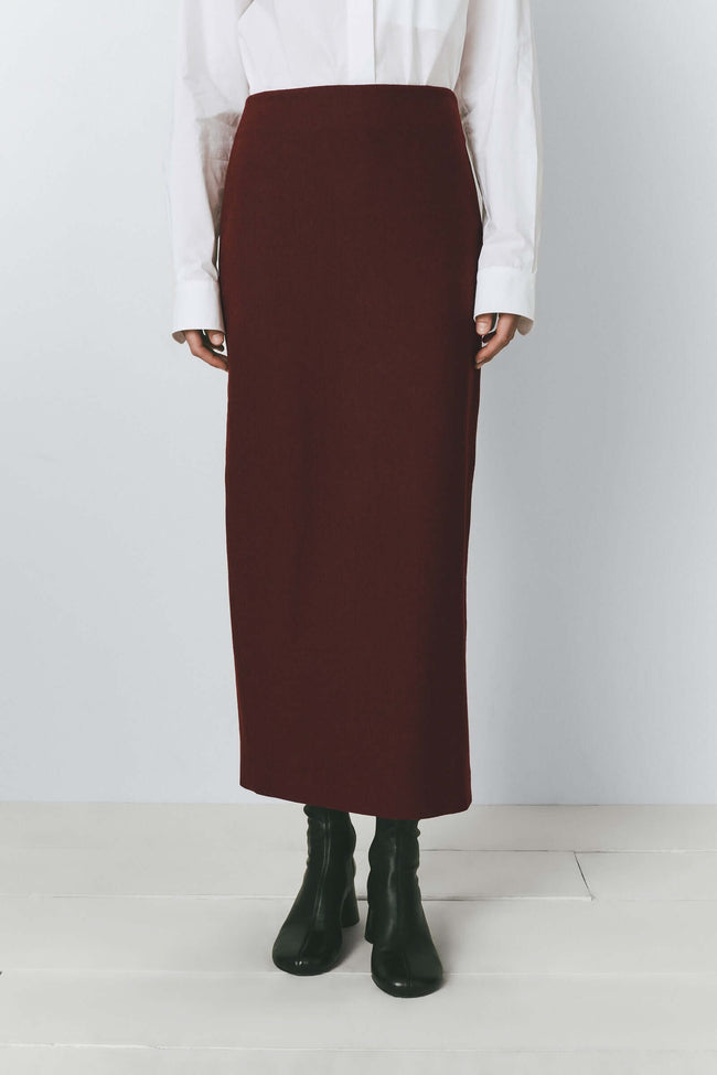 Bordeaux wool blend pencil skirt paired with a white shirt and black boots