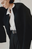 Rue Sophie Jardin Scarf Wool Jacket in black, woman wearing wool coat with belt and white shirt, minimalist look.