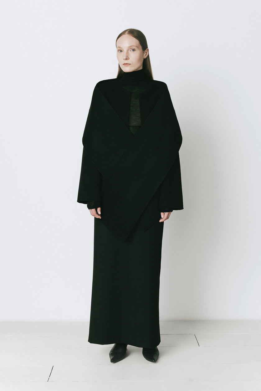 Rue Sophie Jardin black wool and cashmere blend coat with detachable scarf detail, woman in elegant black attire