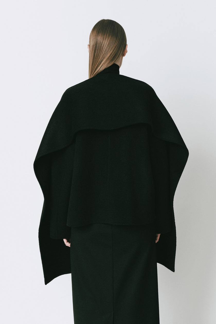 Rue Sophie Jardin black wool cashmere jacket, detachable scarf detail, woman from the back.
