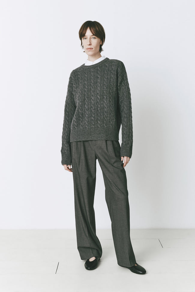 Woman wearing Lyon Cable Knit Sweater in Cinder, wool-cashmere blend