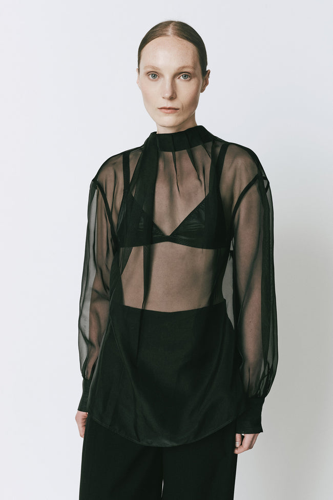 Black organza tie neck top. Oversized fit, ideal for evening wear or sophisticated events.