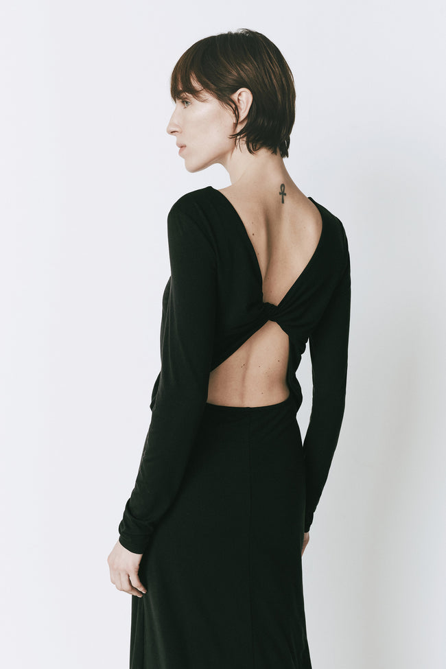 Black René Twist Back Dress with open back detail. Midi-length, long sleeves. Modern woman clothing