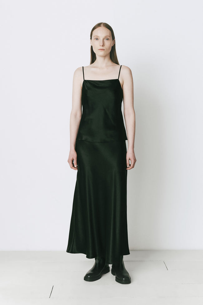 Black silk maxi skirt paired with a silk camisole, fall elegance and fluid drape.