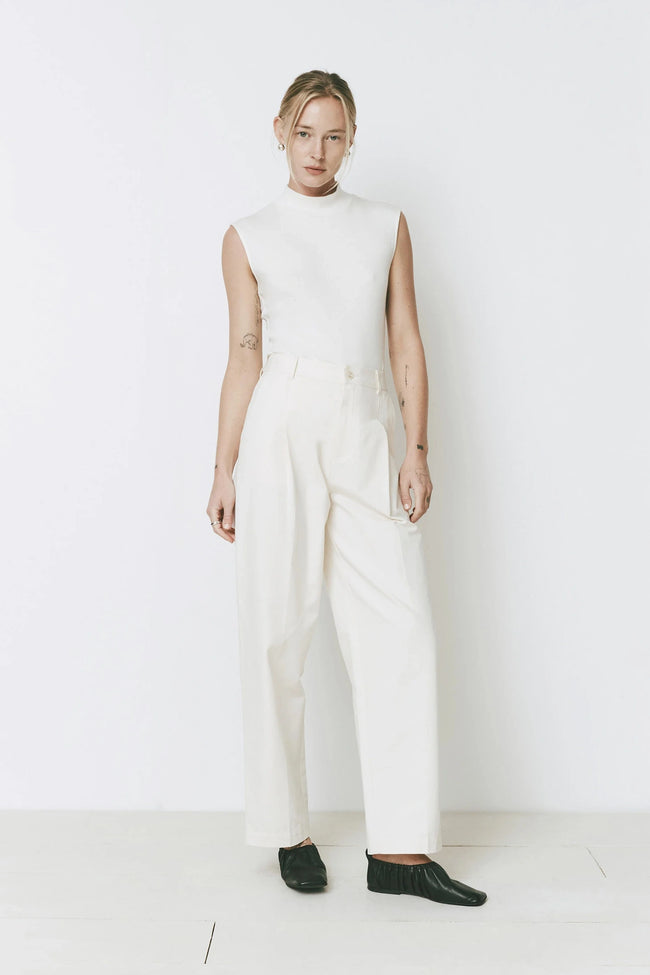 Woman in white Parc pants and top. Minimalist style, designed for tailored ease, Ruesophie fashion.