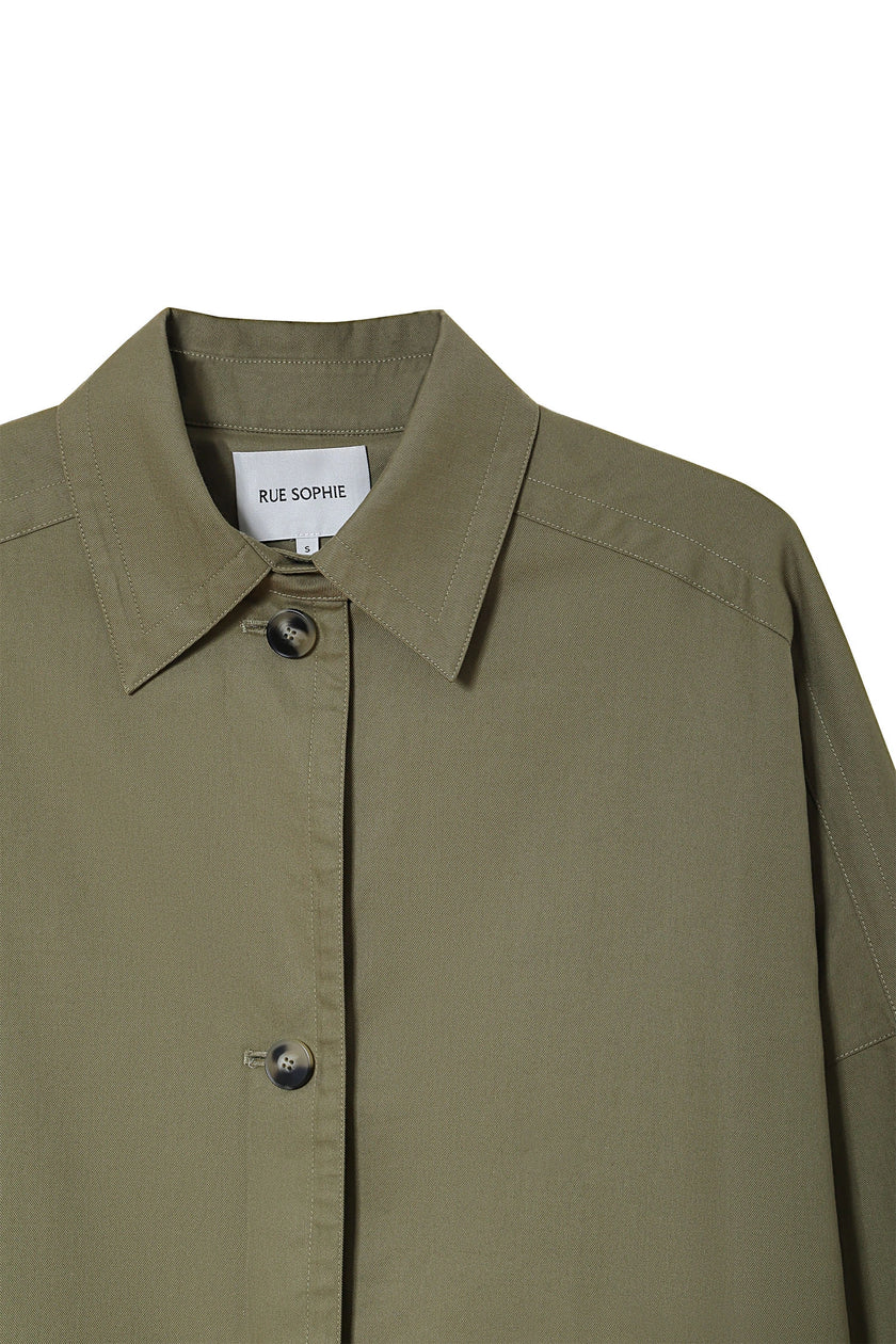 Provenance Oversized Jacket in Mosswood by RUE SOPHIE. Detail of collar and button closure.