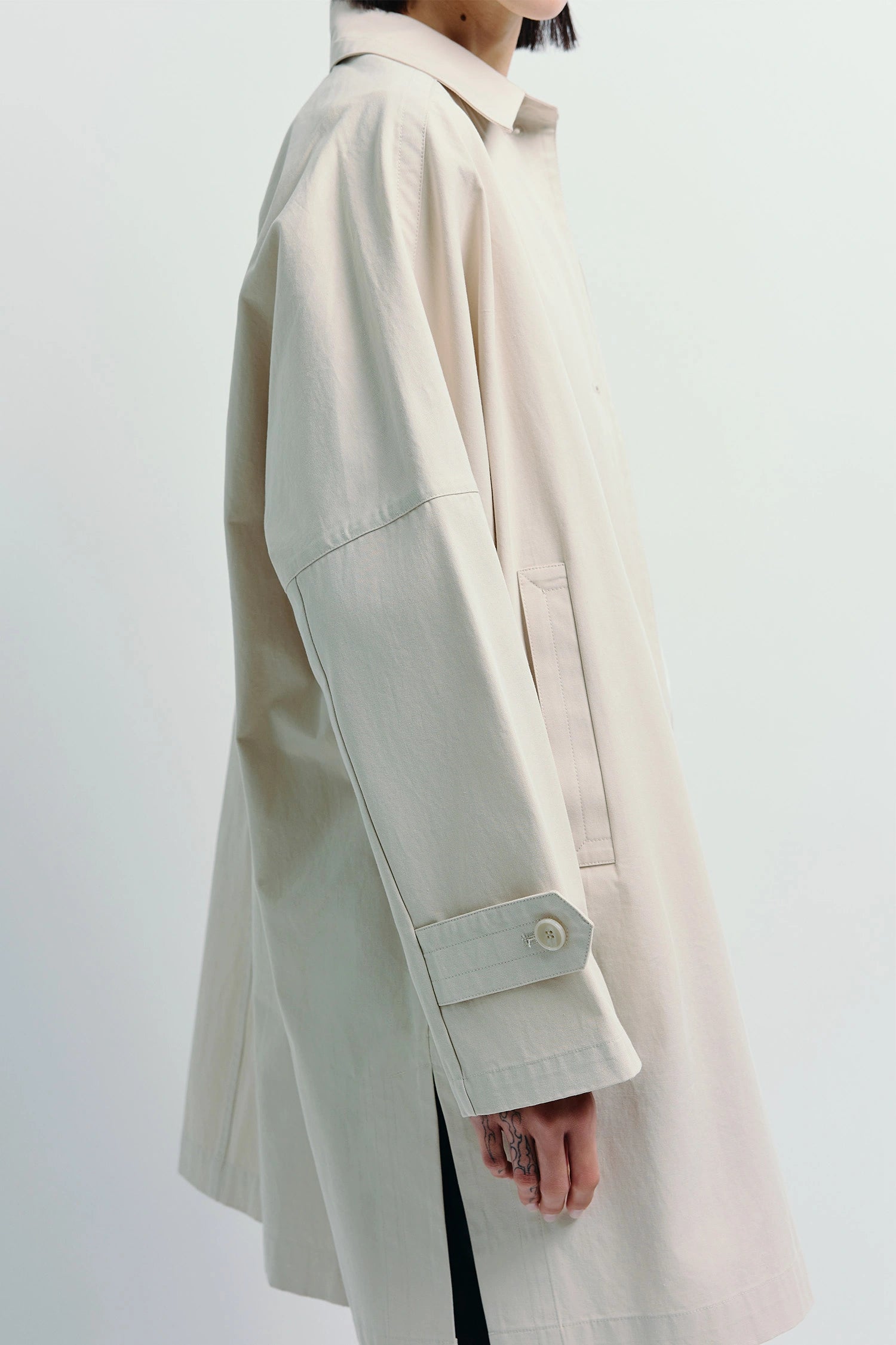 Light beige Provenance Oversized Jacket. Relaxed midi coat with front button closure, unlined for layering.