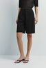 Frankie Drawstring Shorts in black, featuring a relaxed drape and silky touch for women.
