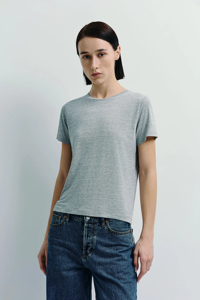 Heather grey crew neck tee made of sustainable cotton, paired with blue jeans. Perfect for everyday wear.