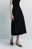 Black Orléans Pocket Pleat Skirt in poplin, A-line silhouette, perfect for women's fashion.