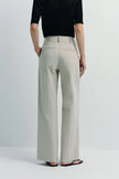 Vélo Crinkled Cotton Wide Leg Pant in light beige, featuring a modern, relaxed drape and pleat front