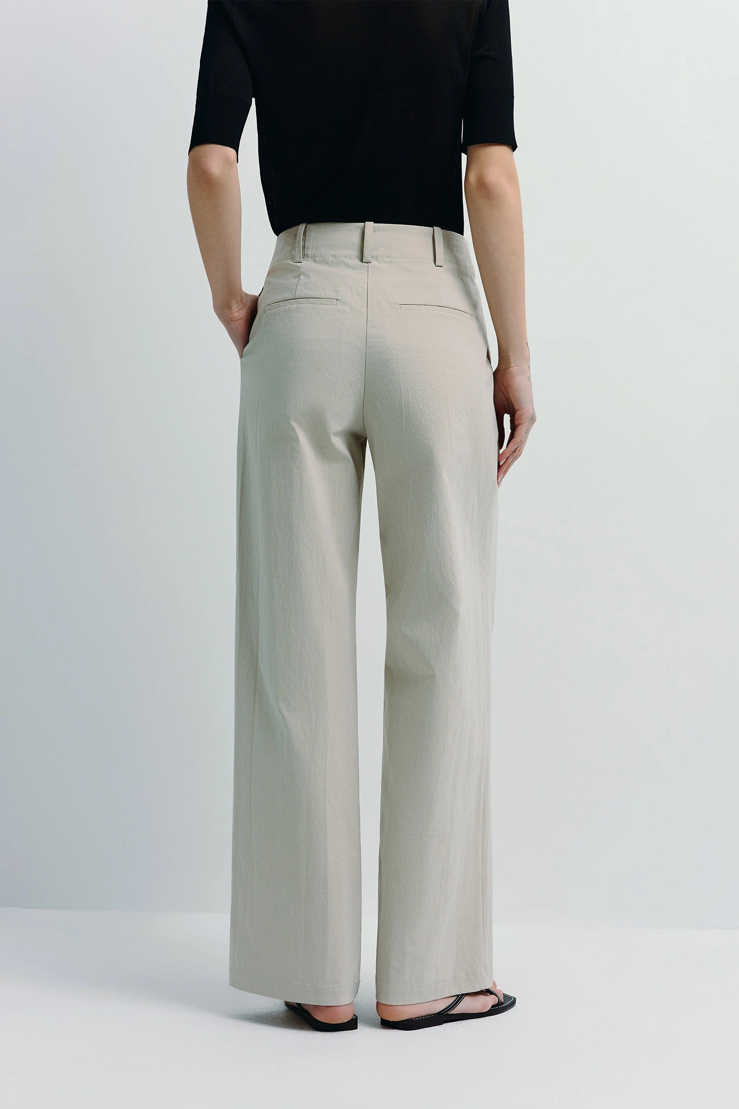 Vélo Crinkled Cotton Wide Leg Pant in light beige, featuring a modern, relaxed drape and pleat front