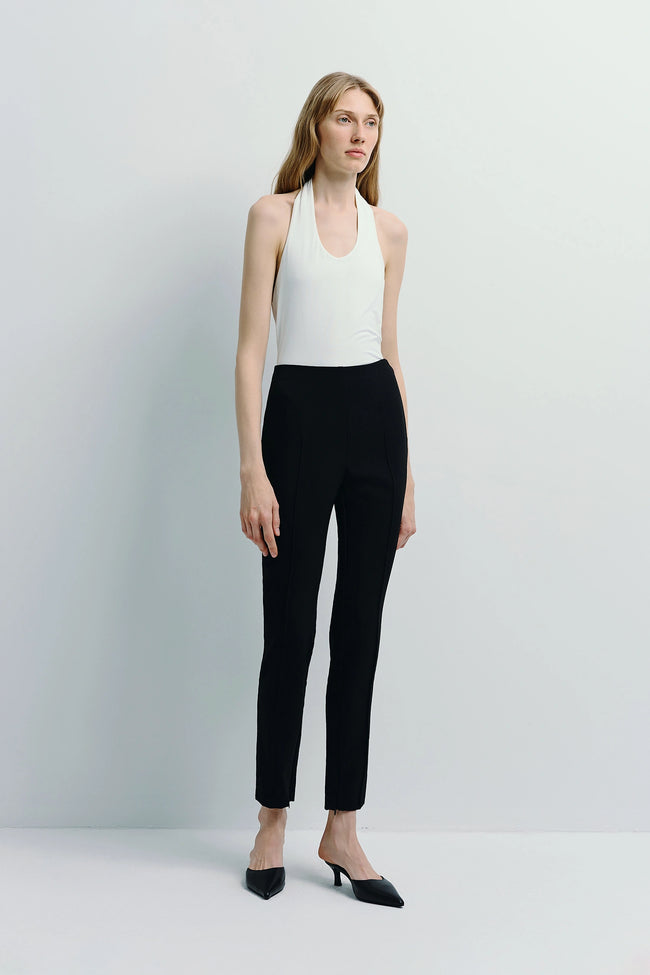 Reims Zip Hem Slim Pant in black with white top, slim-fit, elegant tailoring for modern style