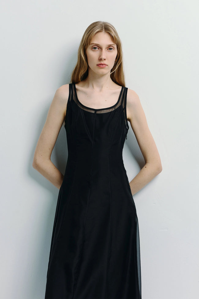 Black midi dress with sheer detail, tailored fit, elegant style