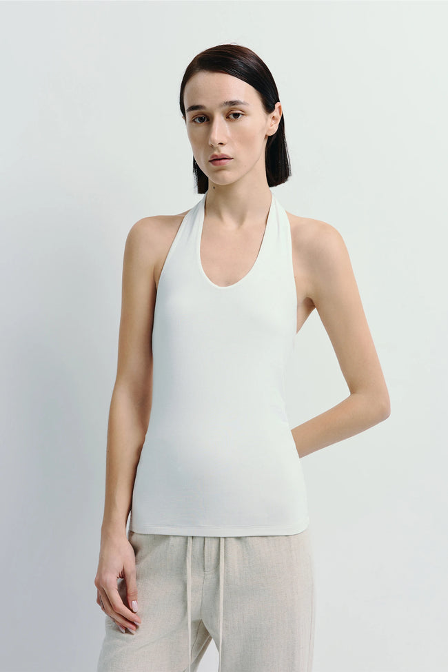 Chaleur Halter Top in white, soft modal blend. Minimalist design, sculpted fit, perfect for a refined look.