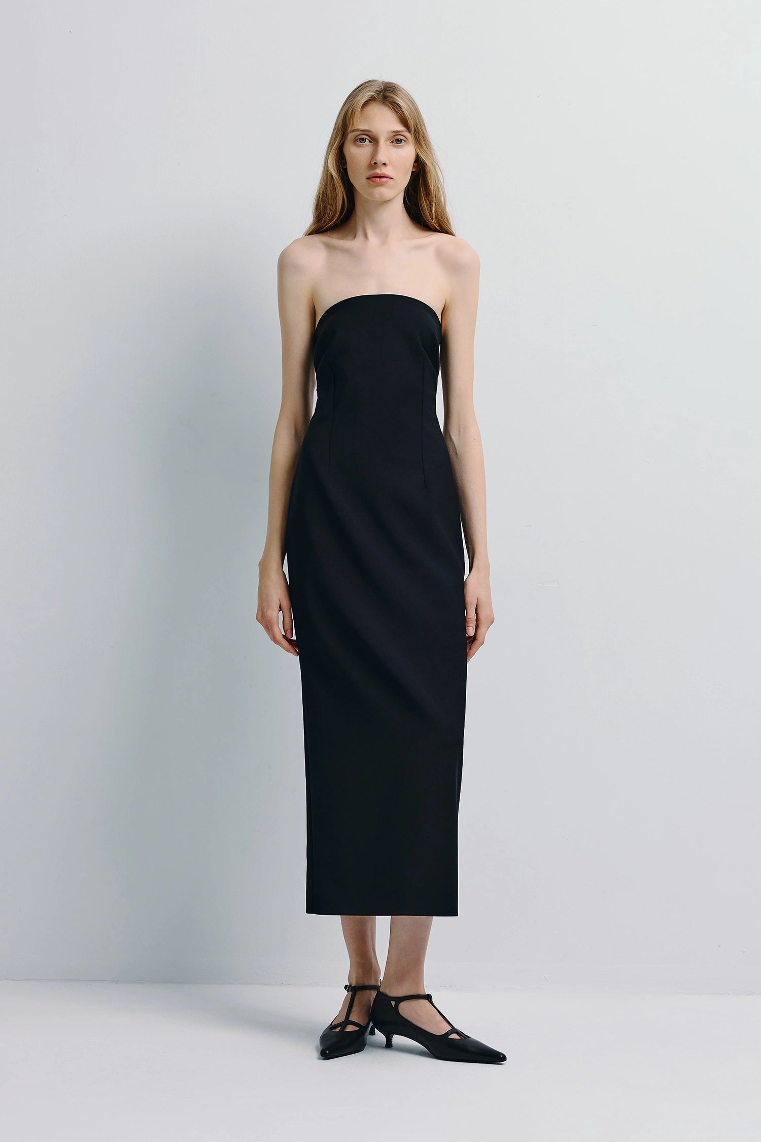 Black Webster Tube Dress. Modern strapless midi dress, wool blend, with sculpted silhouette, perfect for everyday wear.