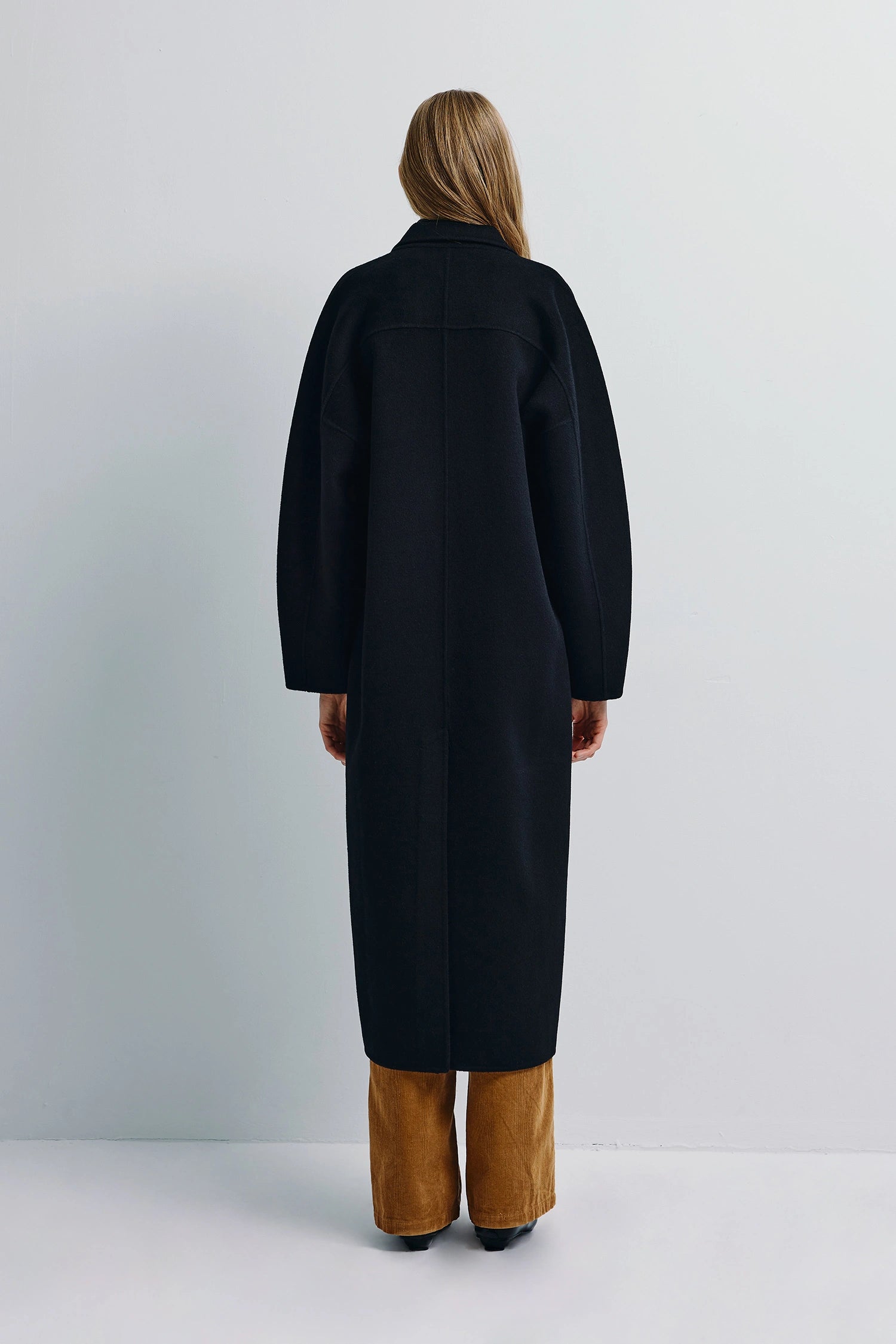 Basile Handmade Black Coat, rear view. Wool-cashmere blend, sharp lines.