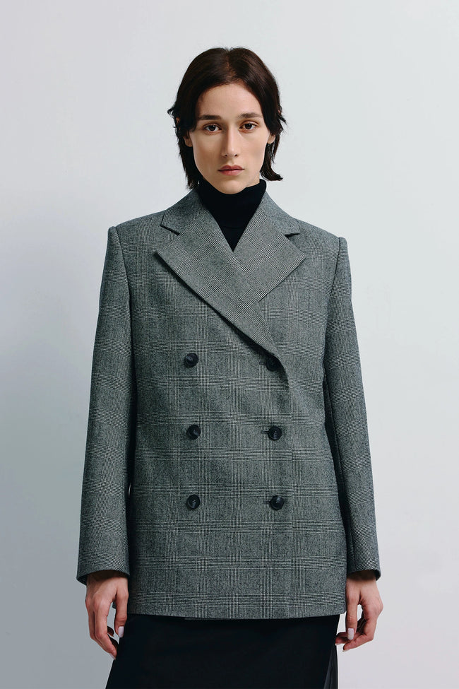 Emery Plaid Blazer in grey wool. Double-breasted with structured shoulders and clean lines, ideal for modern balance.