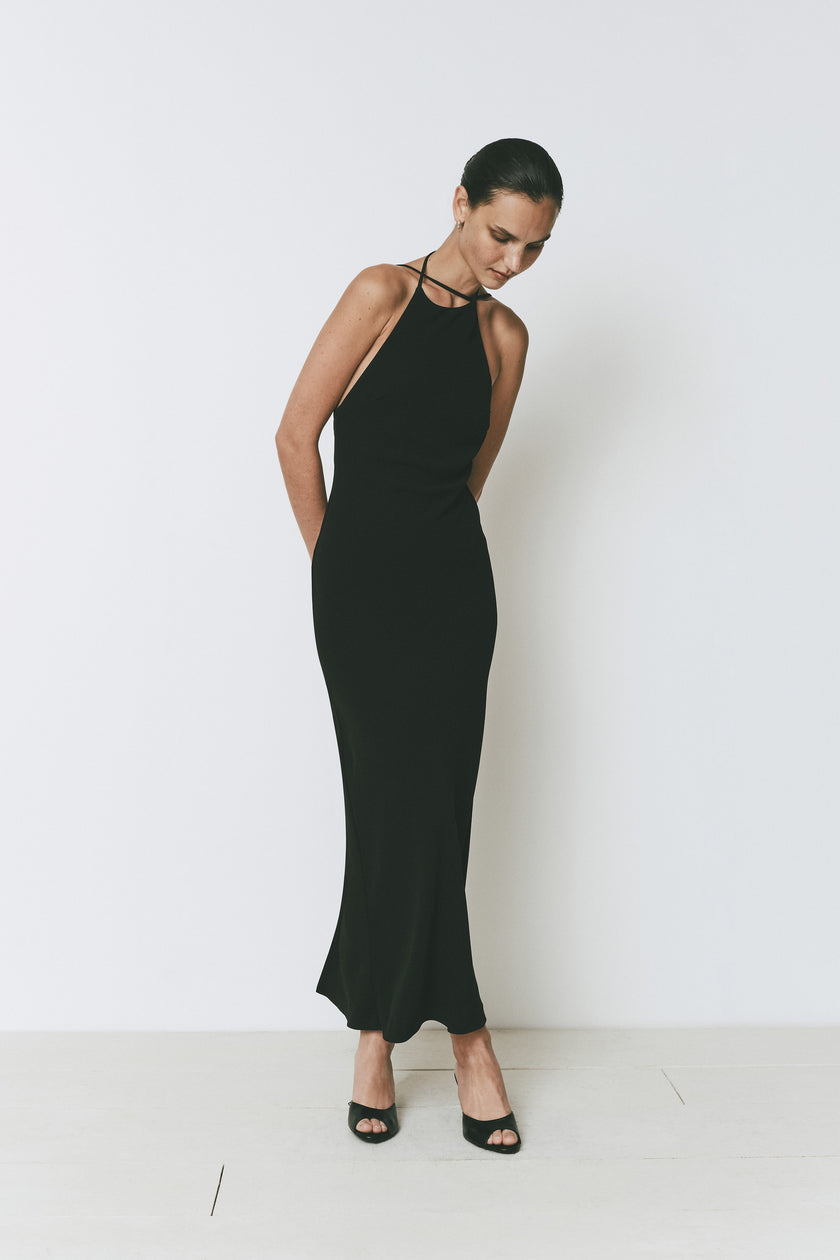 Ruesophie black sleeveless midi Opera Dress with elegant halter neck and deep open back for a refined look.