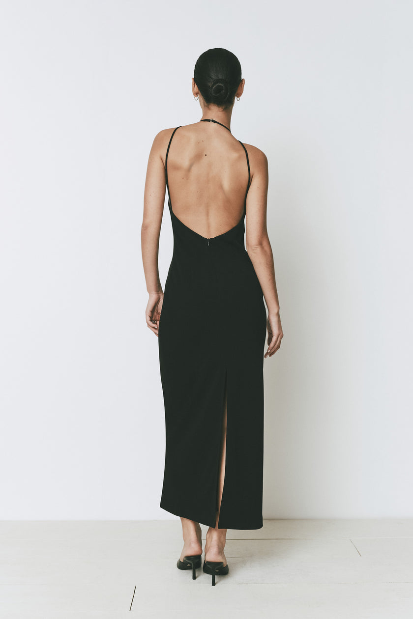 Ruesophie black Opera Dress, midi length with deep open back, halter neck, and elegant back vent slit.