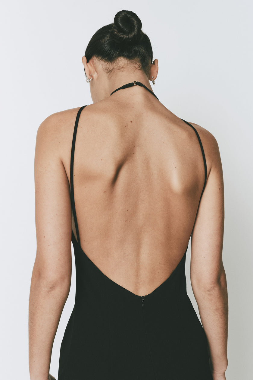 Ruesophie black Opera Dress, elegant deep open back, halter neck closure detail, and concealed zipper.