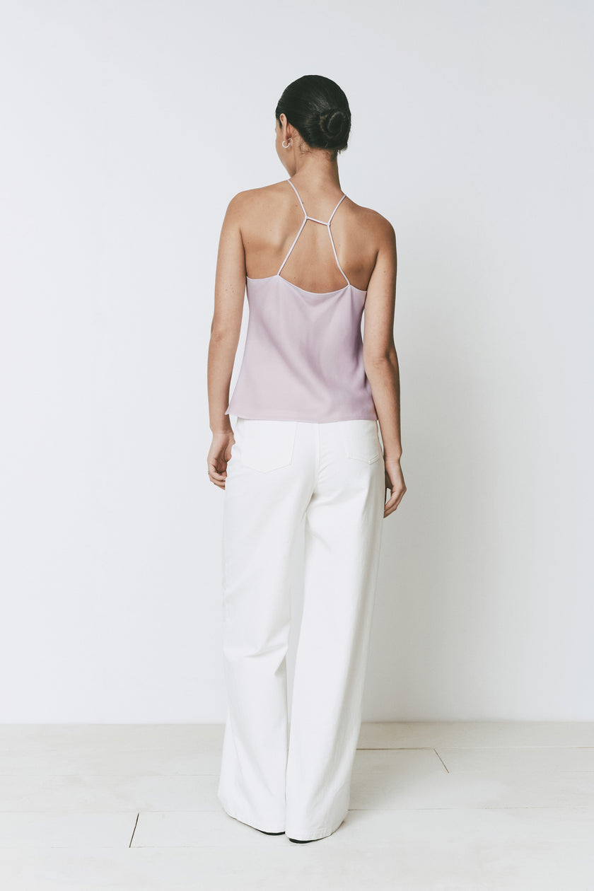 Rue Sophie Arc Top, light purple halter top with back strap detail and white trousers, minimalist design