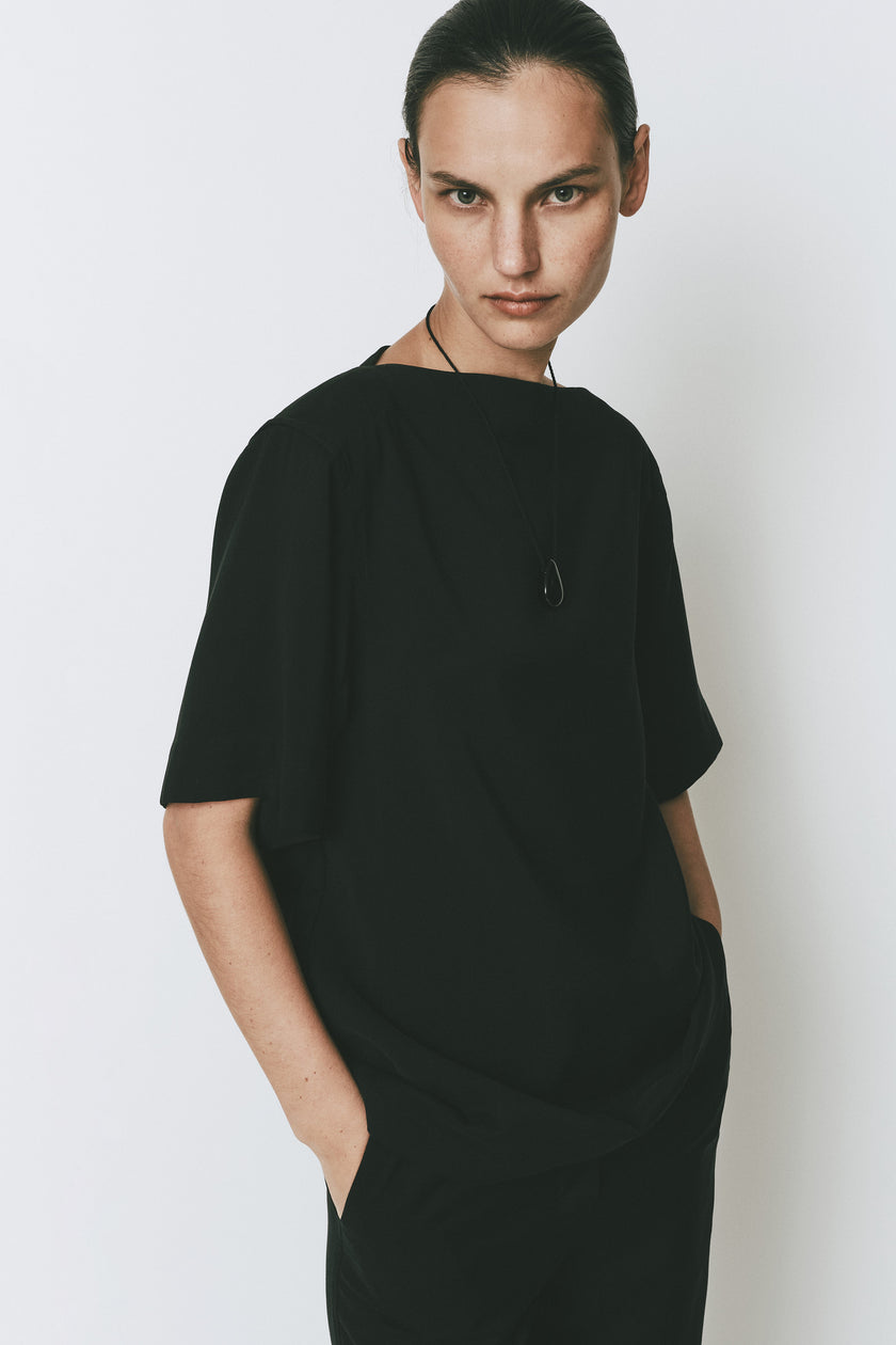 Black Dusk Boatneck Top with quarter sleeves. Modern and minimal design, comfortable relaxed fit. Rue Sophie.
