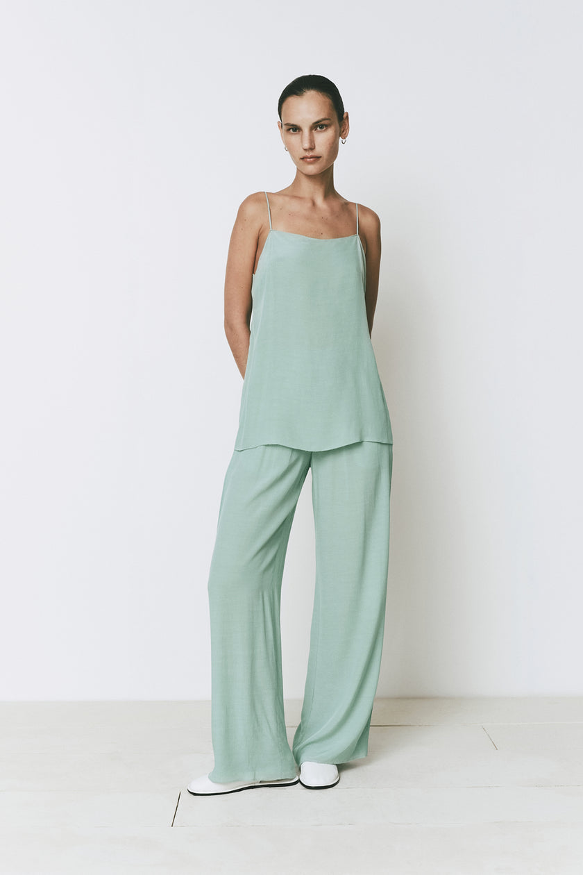 Mint green Esme top and relaxed fit pants set. Spaghetti strap top in a neutral palette.