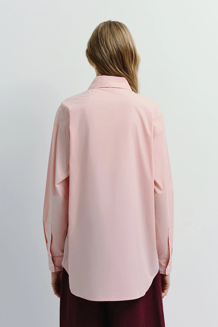 Light pink Alda Button Down Shirt, 100% cotton, relaxed fit, ideal for layering, back view.