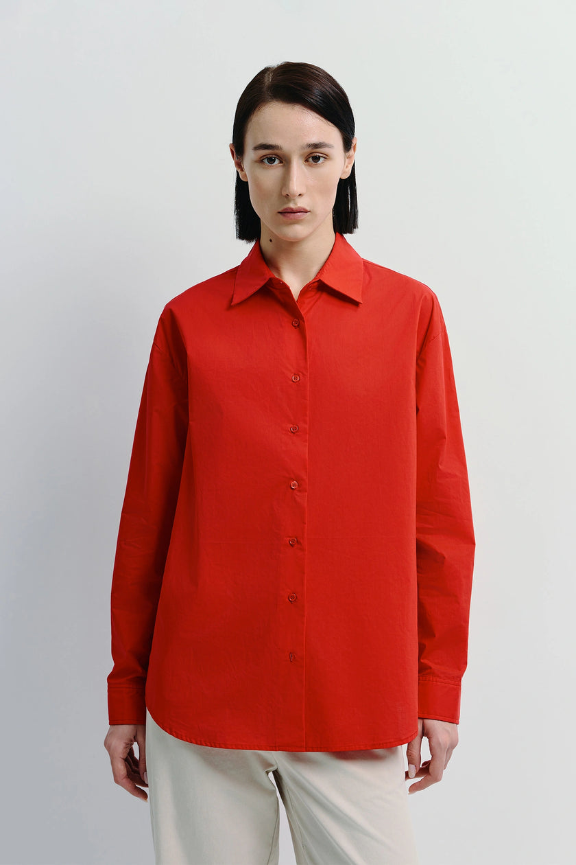 Red Alda Button Down Shirt, 100% cotton, relaxed fit for layering, paired with cream pants.  Product for Ruesophie.
