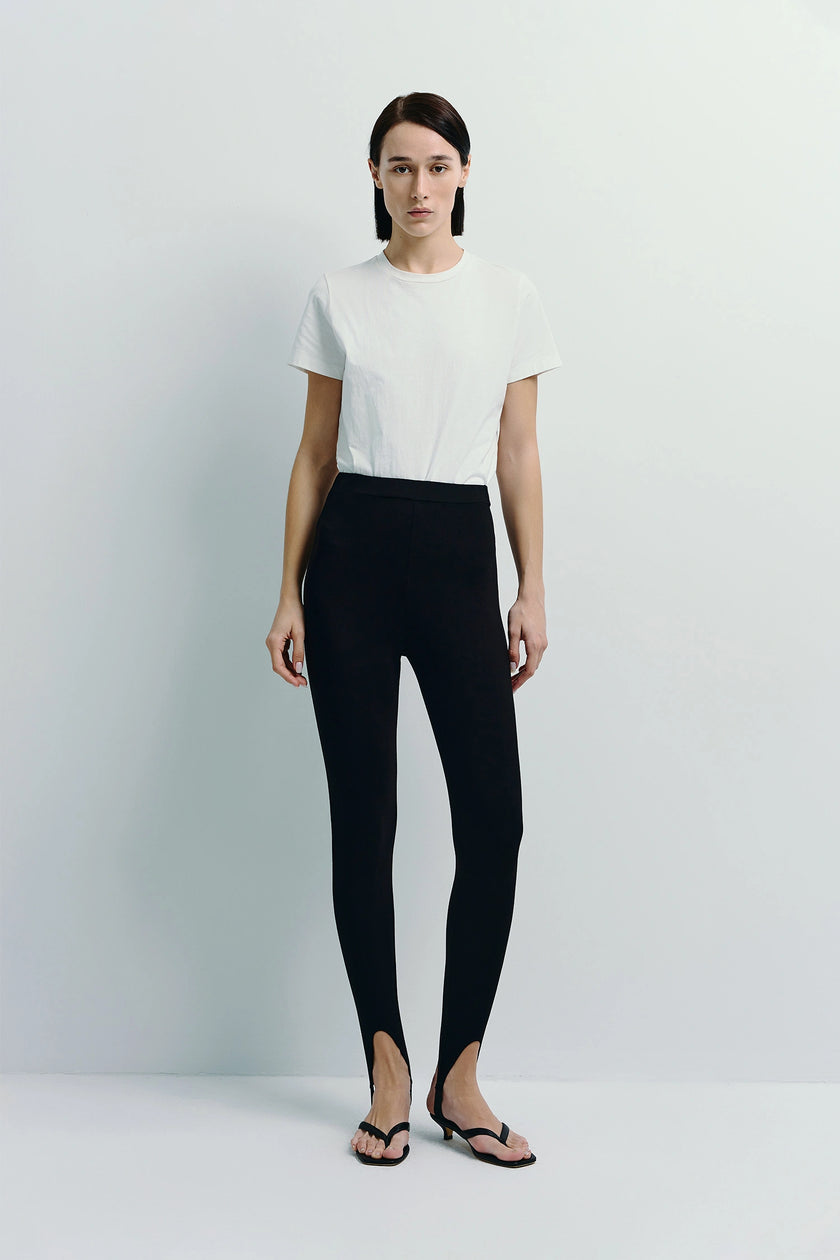 Argo Stirrup Leggings, black, sleek silhouette, stirrup detail, paired with white tee and sandals, Rue Sophie