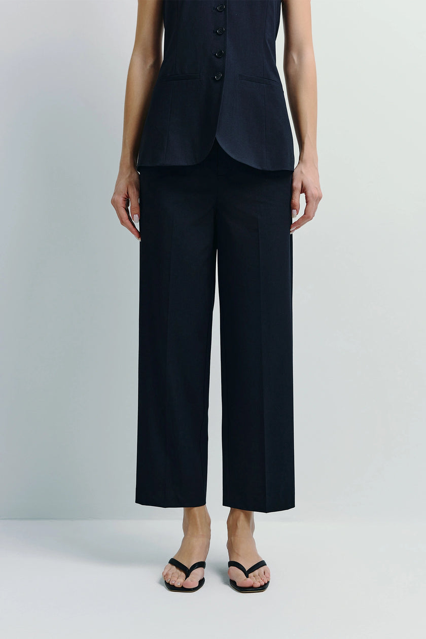 Black Donette Cropped Wide Leg Pant outfit with a vest, modern tailoring and relaxed look
