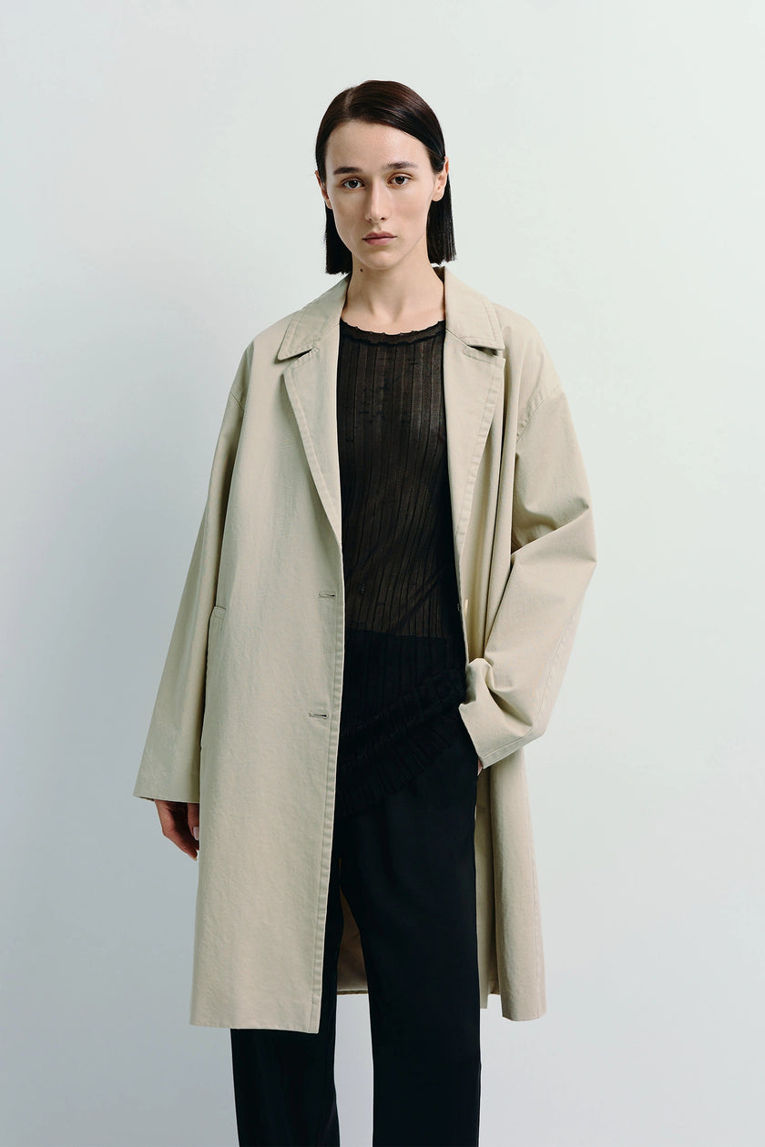 Dune Cotton Twill Coat in light beige. Oversized cotton twill coat, a timeless outerwear piece