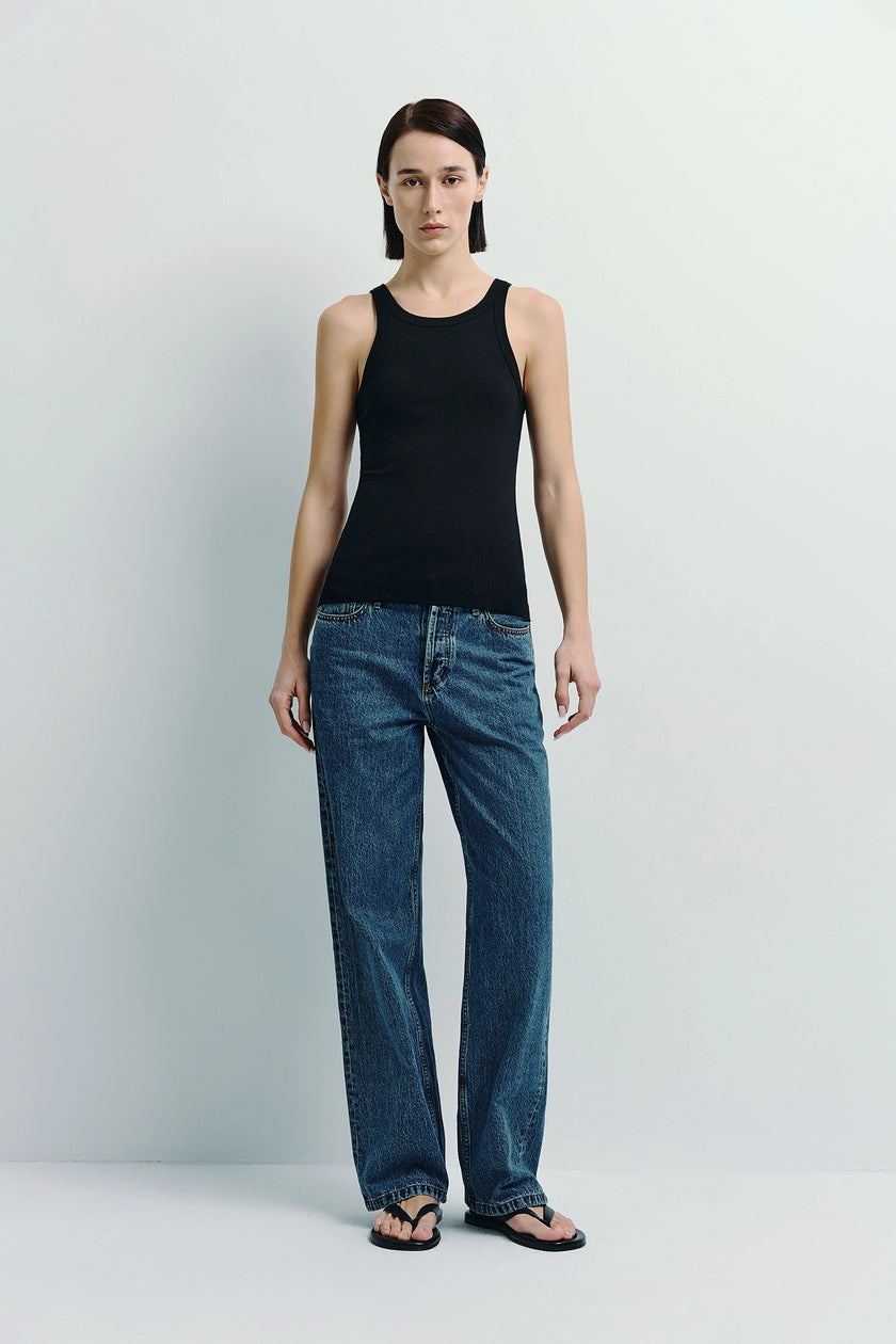 Black Luka Ribbed Tank Top and blue jeans outfit for women. Minimalist style.
